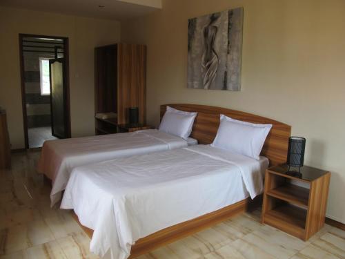 拉惹住宿加早餐旅馆客房内的一张或多张床位