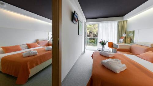 维斯佩拉家庭酒店客房内的一张或多张床位