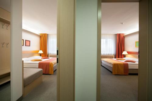 萨瓦服务度假酒店客房内的一张或多张床位