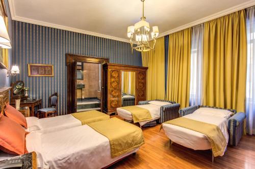 因佩罗酒店客房内的一张或多张床位