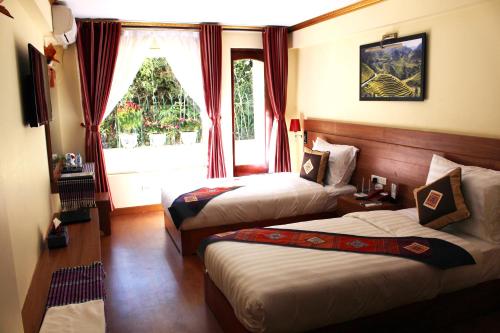 萨帕黄龙酒店客房内的一张或多张床位