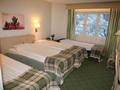 莫达兹兄弟酒店客房内的一张或多张床位