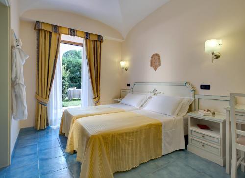 圣吉凡尼特尔米酒店客房内的一张或多张床位