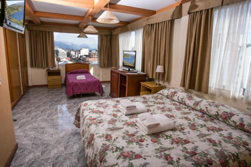 Hotel Aspen Ski客房内的一张或多张床位
