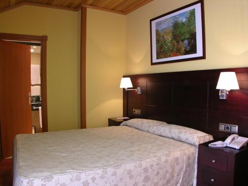 阿维拉城堡二号酒店客房内的一张或多张床位