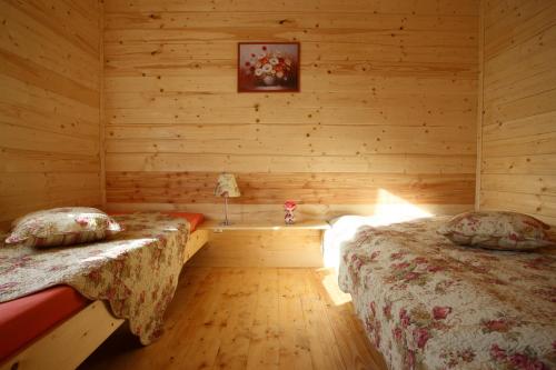 Aida Domki Letniskowe客房内的一张或多张床位
