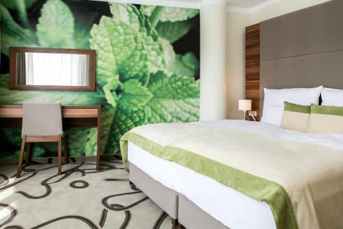 安比恩特阿罗马Spa酒店客房内的一张或多张床位