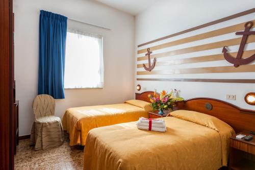 Hotel La Carruba客房内的一张或多张床位