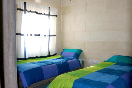 B3 Misrah Ta Cenc客房内的一张或多张床位