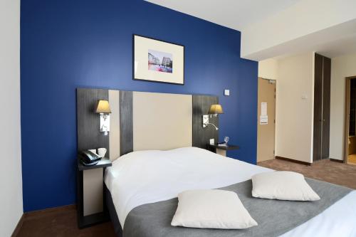 市蒙彼利埃欧诗丹奥德利斯公寓式酒店客房内的一张或多张床位