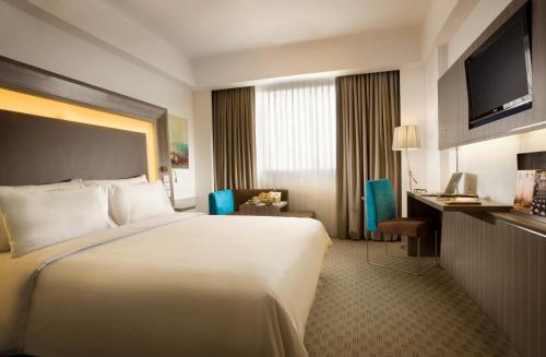 邦加岛诺富特酒店及会议中心客房内的一张或多张床位