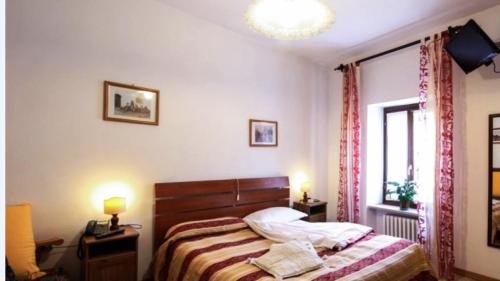 Hotel del Corso客房内的一张或多张床位