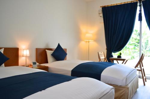 纳塔海滩酒店客房内的一张或多张床位