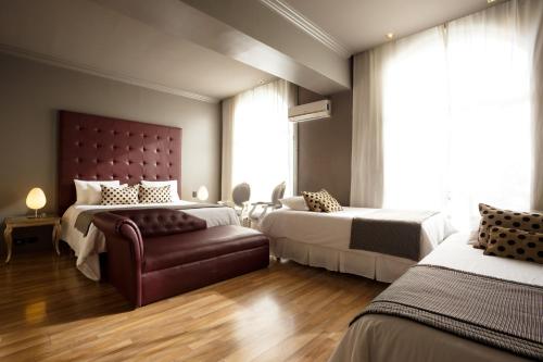 优尼科行政中央酒店客房内的一张或多张床位