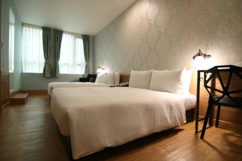 立和商务旅馆- 汉口馆客房内的一张或多张床位