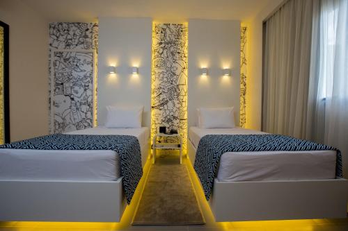 帕尔马斯ibis Styles Palmas的配有两张床的旅馆客房
