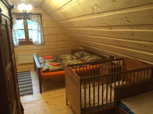 特尔乔夫Drevenica Vanesa的小木屋,房间内设有床