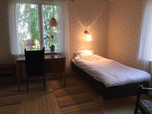 Villa Insikt Pensionat & Kursgård客房内的一张或多张床位
