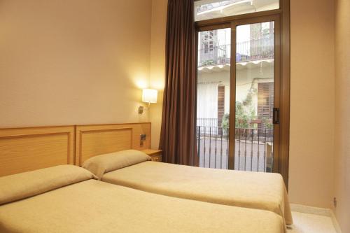新科隆旅馆客房内的一张或多张床位