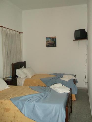 Alojamento local Boavistense客房内的一张或多张床位