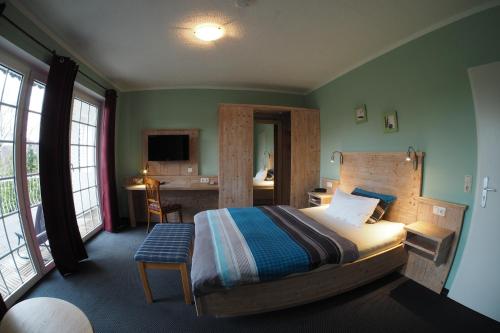 孟克斯特灵格酒店客房内的一张或多张床位