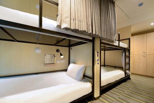 晶赞都会旅店-永和客房内的一张或多张双层床