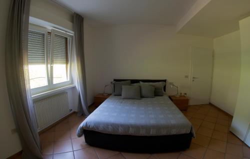 Appartamento i Sentieri 29c客房内的一张或多张床位