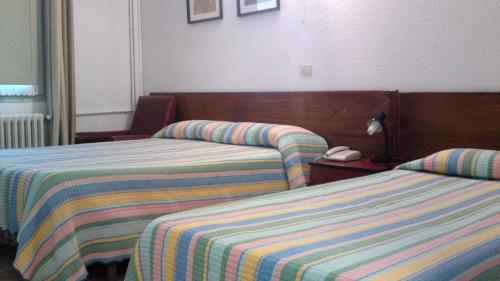 普拉堡酒店客房内的一张或多张床位