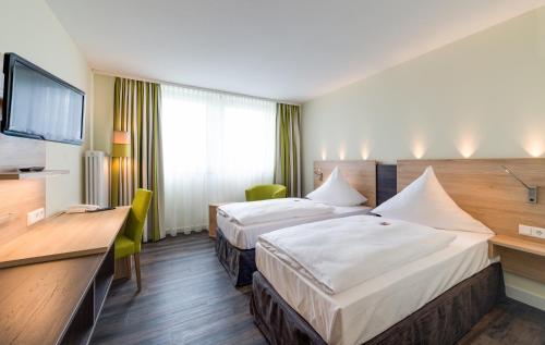 沃德赛诺维娜酒店，纽伦堡市客房内的一张或多张床位