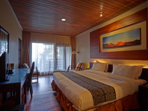 爪哇布罗莫吉瓦度假村客房内的一张或多张床位