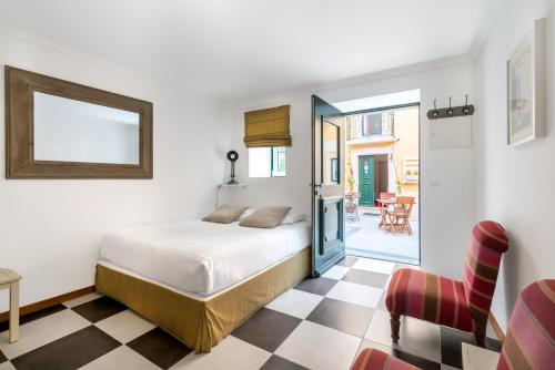 帕特奥斯昂托艾斯特瓦-自助式公寓酒店客房内的一张或多张床位