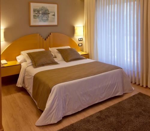 阿雷特科萨特酒店客房内的一张或多张床位