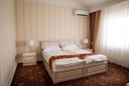 Hotel Grand Aristocrate客房内的一张或多张床位