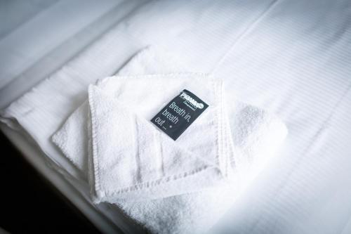善珍夫特尔睡衣公园酒店客房内的一张或多张床位