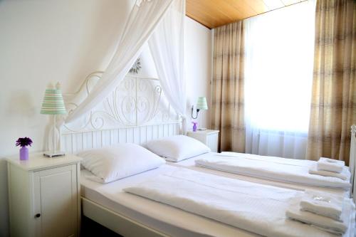 胡恩斯吕克霍夫城市酒店客房内的一张或多张床位