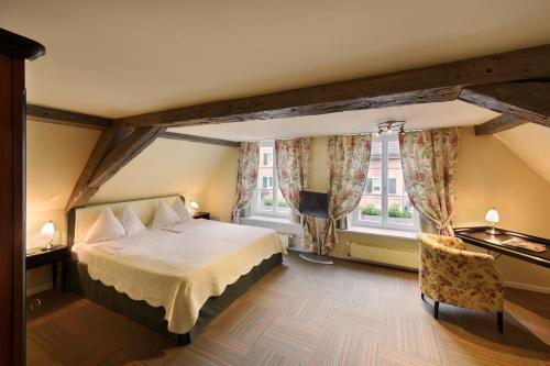Romantik Hotel Schwan客房内的一张或多张床位