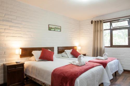 昆卡厄瓜多尔奥拓罗格公寓式酒店客房内的一张或多张床位