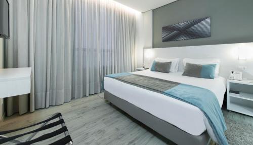 伦多诺波利斯舒适套房酒店客房内的一张或多张床位