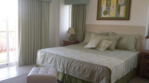 Appartamento Cadaques Bayahibe客房内的一张或多张床位