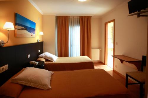 卡姆西亚旅馆客房内的一张或多张床位