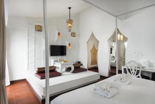 Nimman Mai Design Hotel Chiang Mai - SHA Plus客房内的一张或多张床位