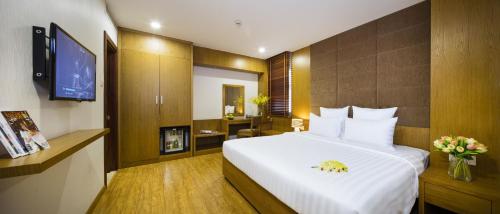 西贡天堂精品Spa酒店客房内的一张或多张床位