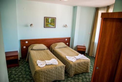 巴日艾克家庭酒店客房内的一张或多张床位