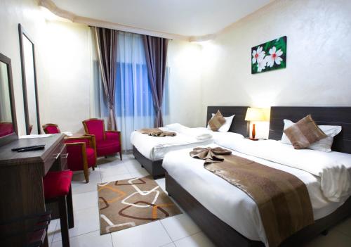 Olive Hotel Amman客房内的一张或多张床位