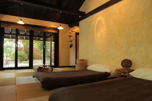 竹富岛阿卡纳亚酒店客房内的一张或多张床位