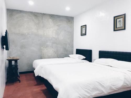 石木酒店 客房内的一张或多张床位