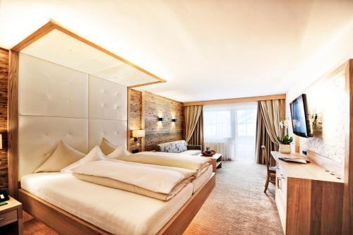 Salnerhof Superior Lifestyle Resort客房内的一张或多张床位