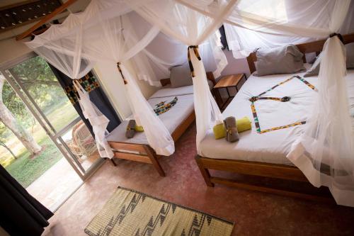 ViaVia Entebbe客房内的一张或多张床位