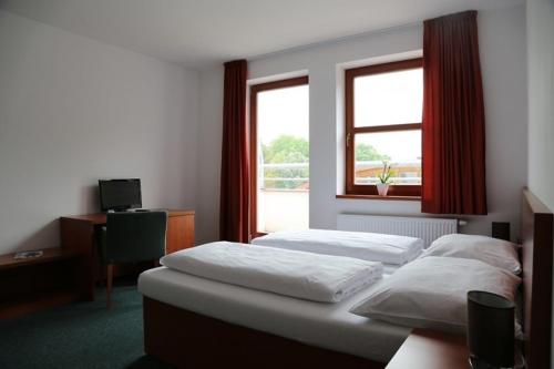 霍斯提维茨运动酒店客房内的一张或多张床位