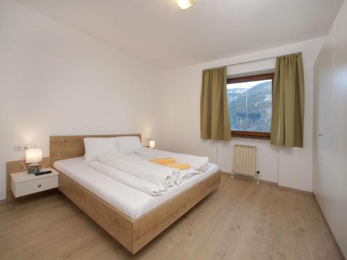 Apartments Obernosterer - Großglockner客房内的一张或多张床位